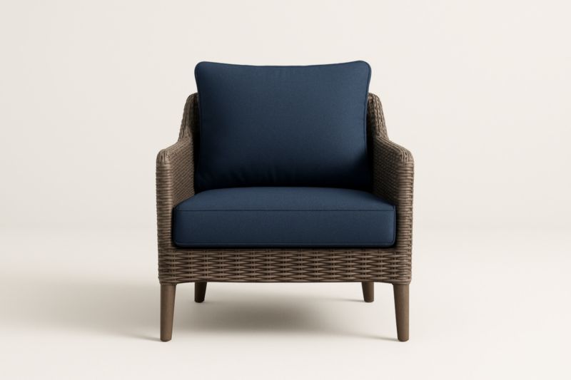 Sillón de ratán sintético marrón con cojines de poliéster azul