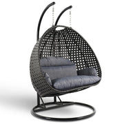 LeisureMod Silla Colgante Huevo para 2 Personas con Soporte - Columpio Hamaca Lounger de Ratán para Patio Exterior/Interior con Cojines
