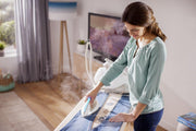 Centro de planchado Philips PerfectCare Elite - Potencia 2400W, golpe de vapor 490g, presión 7.2 bares, tecnología OptimalTEMP, modo ECO, suela T-IonicGlide, depósito 1.8L, blanco/dorado (GC9642/60)
