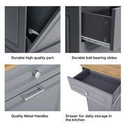 Mueble de cocina para basura con frente abatible, encimera de madera y cajón organizador