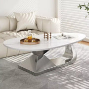 Mesa de centro con superficie de cerámica y base contemporánea de acero inoxidable, una pieza elegante y duradera para la sala de estar.
