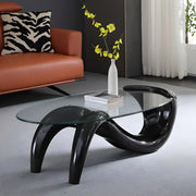 Mesa de centro abstracta moderna con base de metal y cubierta de cristal ovalada