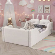Cama plataforma doble Whisen, cama de suelo tapizada para niños con cojín de conejo, barandillas laterales extraíbles