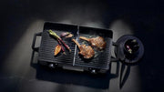WMF Lono Master-Grill, parrilla eléctrica, 50x28 cm, parrilla de mesa eléctrica con protector contra el viento y bandeja de goteo, certificada para uso en exteriores, 2 superficies de cocción regulables por separado, 2400 W, acero inoxidable mate