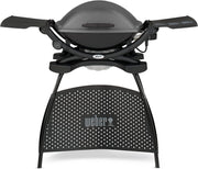 Barbacoa eléctrica Weber Q2400 con soporte y mesas laterales, superficie de cocción de 54 x 39 cm, portátil, parrilla de cocción de hierro fundido vitrificado dividida en 2 partes, tapa y cuerpo de aluminio fundido - Gris oscuro (55020879)