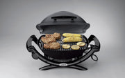 Barbacoa eléctrica Weber Q1400, superficie de cocción de 43 x 32 cm, barbacoa portátil, rejilla de cocción de hierro fundido vitrificado dividida en 2, tapa y cuerpo de aluminio fundido - Gris oscuro (52020079)