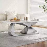 Mesa de centro con superficie de cerámica y base contemporánea de acero inoxidable, una pieza elegante y duradera para la sala de estar.