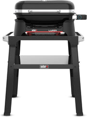 Barbacoa eléctrica Weber Lumin con soporte/Hasta 315 °C, con termómetro en la tapa, rejillas de hierro fundido vitrificado, superficie de cocción de 33 x 49 cm, negro (92010879)