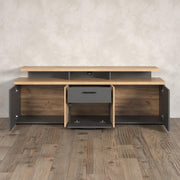 Mueble para TV trendteam smart living Esteban, gris/roble, con 4 puertas, 1 cajón, 1 puerta abatible, 3 compartimentos abiertos (ancho x alto x fondo) 180 x 67 x 47 cm, 2 puertas con diseño estriado, montaje reversible (derecha/izquierda)