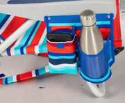Silla de playa Tommy Bahama modelo 2025. A rayas rojas y azules.