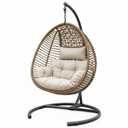 Sillón colgante de ratán con estructura de acero y cojín de poliéster beige