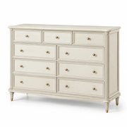 Cómoda de 9 cajones de madera y tiradores de metal en color blanco crema