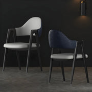 Silla de comedor con reposabrazos de cuero moderna curvada de respaldo abierto