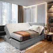 Cama boxspring TRADA ADÈLE 140x200 cm - cama eléctrica con colchón, sobrecolchón y arcón - tapizado de terciopelo - Gris claro
