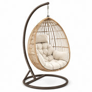 Sillón colgante de ratán con estructura de acero y cojín de poliéster beige
