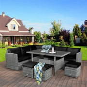 Conjunto de muebles de comedor para patio de 7 piezas de ratán con sofá seccional, mesa de comedor, otomanas y cojines