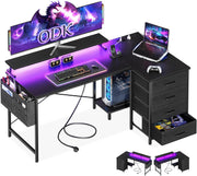 Escritorio en esquina ODK con 4 cajones de tela, escritorio en forma de L reversible de 140x80 cm con 2 enchufes y 2 puertos de carga USB, escritorio gaming en forma de L con LED y soporte para monitor para oficina en casa, negro