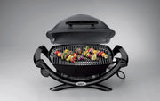 Barbacoa eléctrica Weber Q1400, superficie de cocción de 43 x 32 cm, barbacoa portátil, rejilla de cocción de hierro fundido vitrificado dividida en 2, tapa y cuerpo de aluminio fundido - Gris oscuro (52020079)